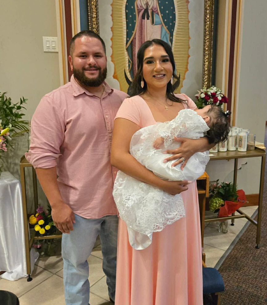 Mitchell and Erika at their daughter's baptism